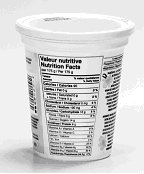 Yogurt container with tapered Nutrition Fact table. The NFT narrows towards the bottom of the container to follow its shape. This is not permitted.